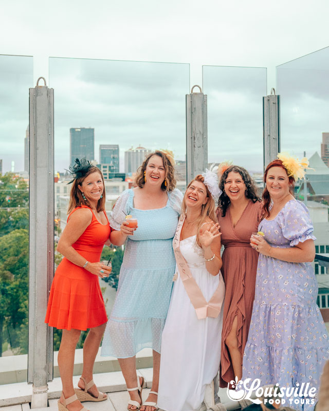 Bachelorette Party in Louisville, KY in front of the skyline on a rooftop